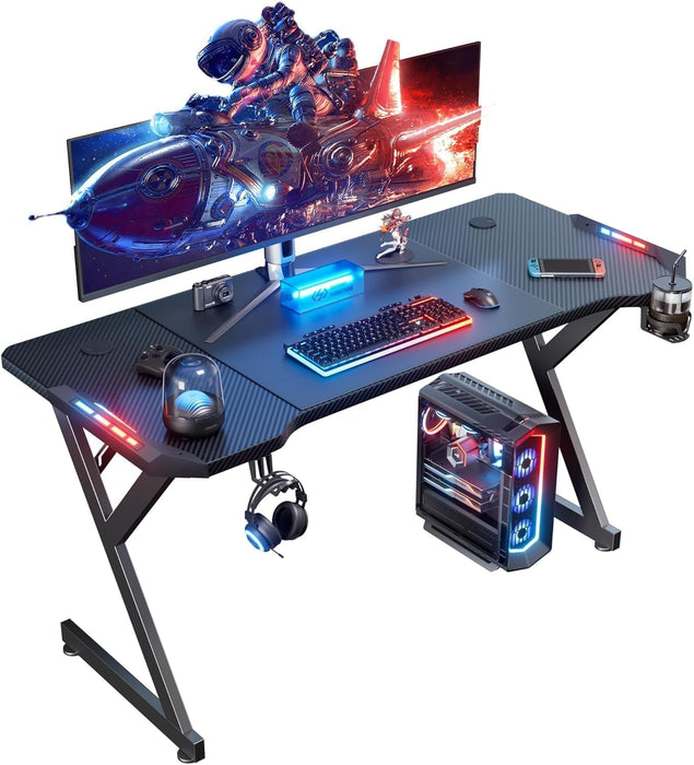 63 INCH Gaming Desk with LED Lights, Home Office Gamer Desk, Ergonomic Computer Table with Large Carbon Fiber Desktop, Office Workstation with Mouse Pad, Cup Holder & Headphone Hook, Black - ShipItFurniture