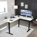 Corner Standing Desk, 63 X 55 Inch Reversible L-Shaped Workstation, Electric Height Adjustment, Home, Office, and Reception Rooms, White Table Top Black Frame, DESK-E3CTBW