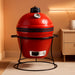 Joe Jr 13.5-Inch Portable Ceramic Charcoal Grill with Grill Stand, Stainless Steel Cooking Grate, Heat Deflectors and Ash Tool in Red, Model KJ13RH