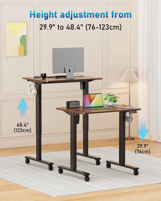 32" Small Electric Rolling Standing Desk Adjustable Height, Mobile Sit Stand up Desk with Lockable Casters for Home Office & Computer Workstation, Splice Board, 2 Hooks, Black Frame/Walnut Top