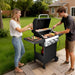 3 Burners Portable Gas Grill with Enameled Cast Iron Grates, Powerful 36,000 BTU Propane Grill with Side Shelf & Bottom Cabinet, Outdoor Grill with Wheels for Patio Backyard Garden BBQ Use