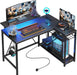 Gaming Desk with Power Outlets, 42" L-Shaped Computer Desk with LED Lights, Desk with Reversible Storage Shelves & Hooks for Small Spaces, Bedrooms & Offices, Black Carbon Fiber