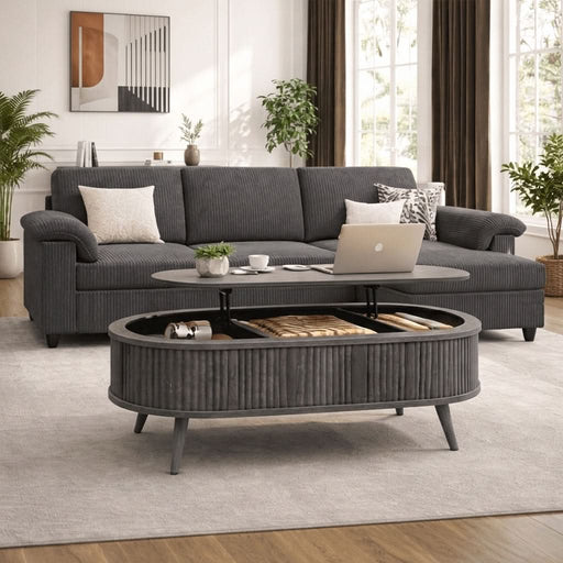 Full view of gray sectional sofa and ottoman in modern living room showing reversible layout and natural light.